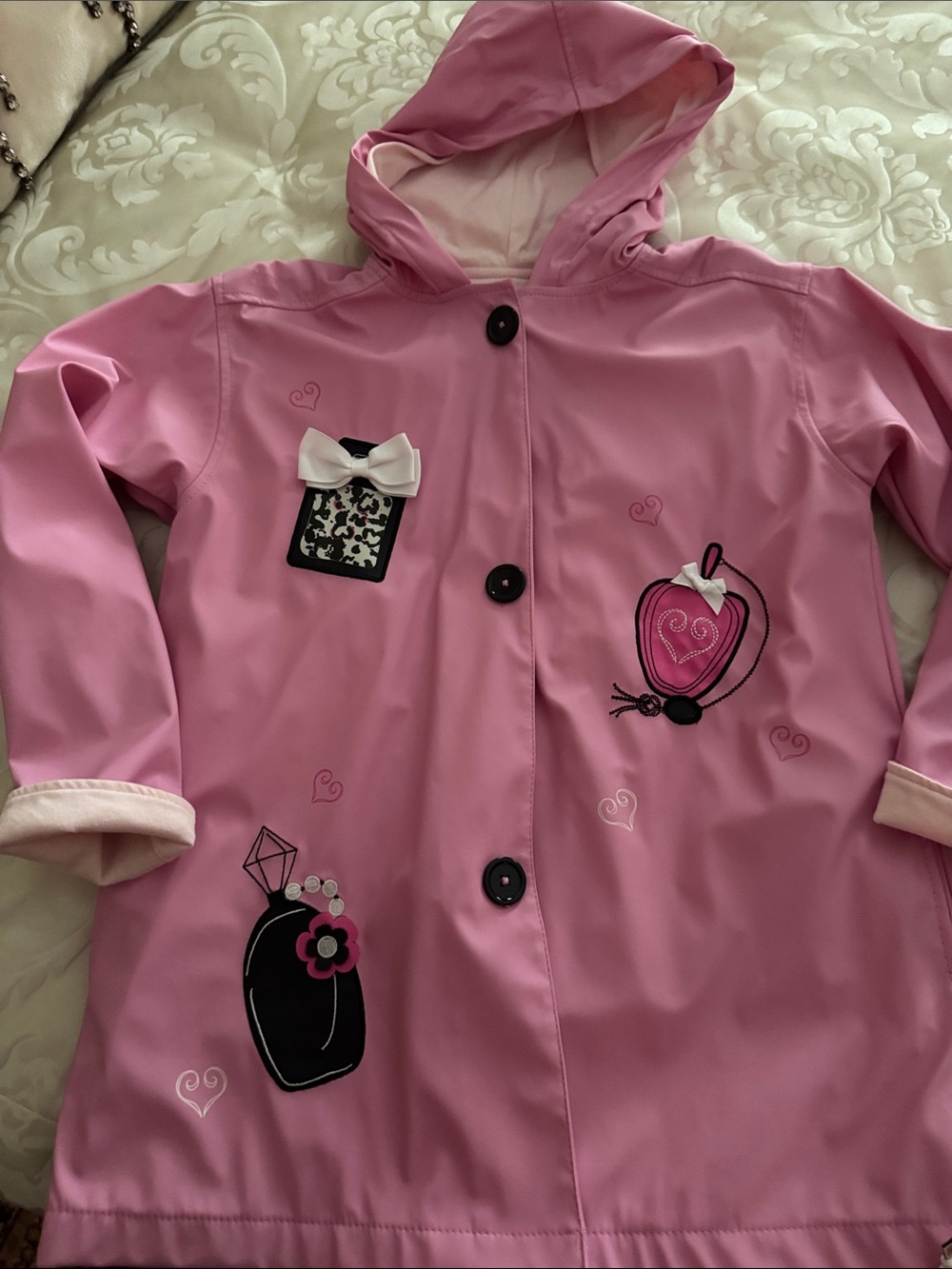 Hartstrings Pink Hooded Girls' Raincoat with Bow and Perfume Appliqués